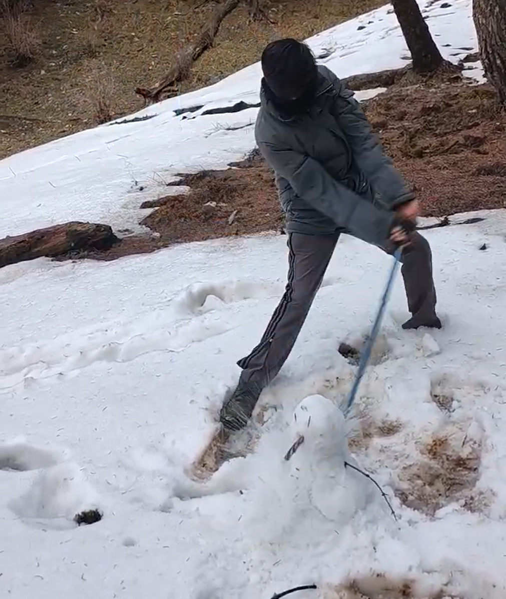 Right: S.Y. destroying the snowman